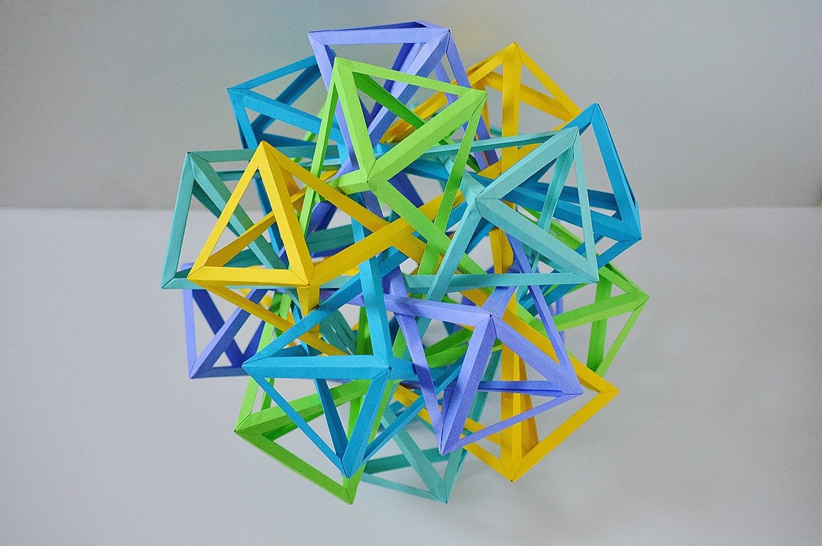 Five Interlocking Irregular Hyperboloidal Dodecaugmented Cuboctahedra